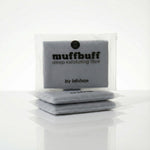 Gray exfoliating scrubber with 'muffbuff' branding on a white background