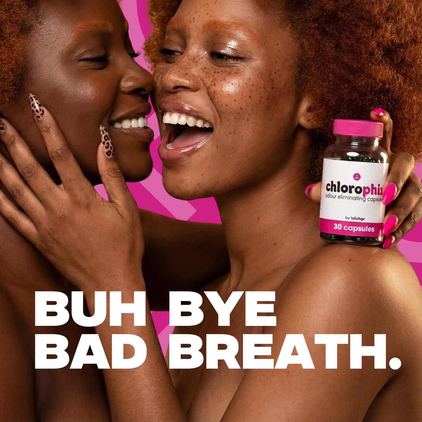 Two women laughing with a bottle of Chlorophyll supplements against a pink background.