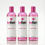 Three bottles of Helixir sugar & shea body elixir on a white background