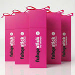 Pink packaging boxes with 'fuhqestick by lafuhqe' branding on a light pink background