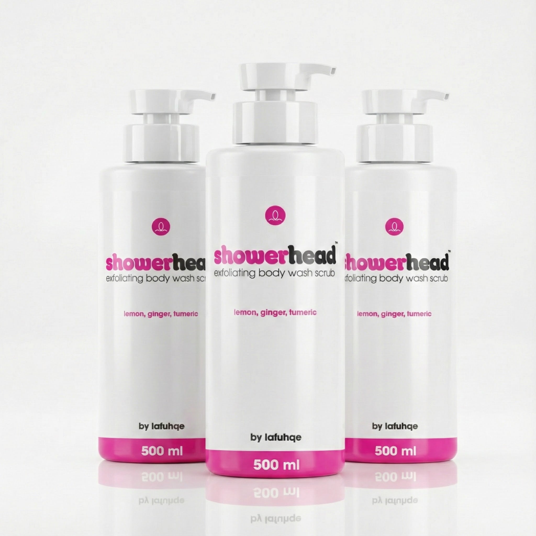 Three bottles of 'showerhead' exfoliating body wash scrub on a white background