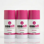 Three bottles of 'assntt' all natural intimate deodorant with pink caps on a white background.